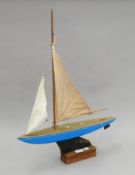 A vintage pond yacht on stand. 50 cm long.