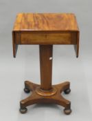 A Victorian mahogany pedestal Pembroke table. 47 cm wide closed.