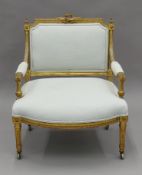 A 19th century French upholstered giltwood open armchair. 65 cm wide.
