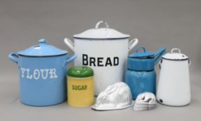 A quantity of kitchenalia, including an enamel bread bin, an enamel flour bin, rabbit form moulds,