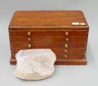 A late 19th/early 20th century artist's walnut pastel cabinet together with a quantity of pastels.