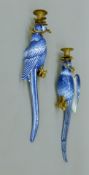 A pair of gilt metal-mounted blue and white porcelain parrot-form wall sconces. Each 47 cm high.