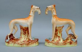 A large pair of circa 1855 Thomas Parr Staffordshire porcelain greyhounds. Each 28 cm high.