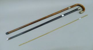 Two silver-mounted walking sticks and a brass rule. The larger walking stick 87 cm high.