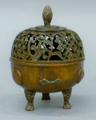 A small Chinese bronze lidded censer. 9 cm high.