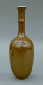 A small brown-glazed Chinese porcelain vase. 17 cm high.
