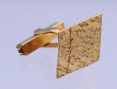 A 9 ct gold cufflink. 1.5 x 1.5 cm. 3.1 grammes.