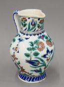 A large 19th century Iznik Turkish pottery jug decorated with typical decoration and palette.