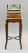 A Victorian oak tantalus on stand. 108.5 cm high.