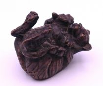 A small bronze model of tiger and cub. 4.5 cm high.