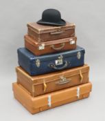 Five various vintage cases and a bowler hat.