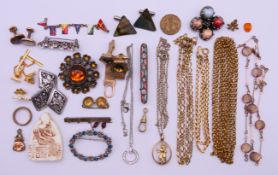 A quantity of various jewellery to include: brooches, cufflinks, shirt studs, chains,