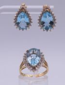 A 9 ct gold pear-shaped blue stone ring and a pair of matching 9 ct gold earrings. Earrings 1.