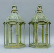 A pair of filigree lanterns. Each 50 cm high.