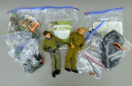A quantity of vintage Action Man figures and accessories. The figures each 29 cm high.