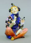 A Royal Doulton porcelain Lady Jester sitting HN 1284. 10.5 cm high.