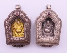 A pair of white metal Tibetan Gau amulet pendants. Each 5 cm high.