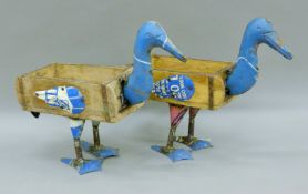 A pair of metal-mounted wooden duck planters. Each 47 cm long.