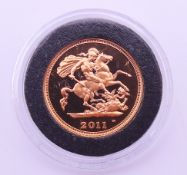 A boxed 2011 fourth portrait of Her Majesty Queen Elizabeth II 22 ct gold half sovereign.