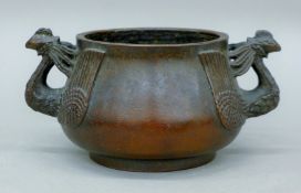 A Chinese bronze censer. 17 cm wide.
