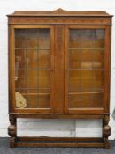 An early 20th century glazed oak bookcase. 106 cm wide.