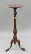 An Edwardian mahogany torchere. 107 cm high.
