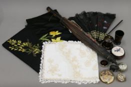 A quantity of miscellaneous items, including a parasol, a fan, a tape measure, compacts etc.