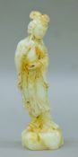 A Chinese carved stone figure of Guanyin. 20 cm high.