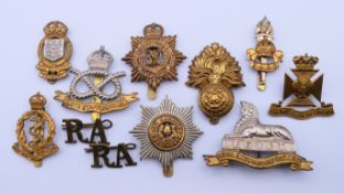 Ten World War I and World War II cap badges. Royal Lincolnshire badge 6 cm wide.
