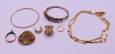A small quantity of yellow metal jewellery, to include: bangles, two single earrings, a necklace,