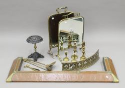 A Victorian brass and copper fender, various fire irons, a brass fender, brass candlesticks,