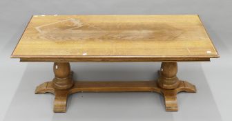 A large oak coffee table. 139 cm long x 53 cm high.