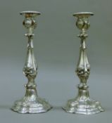 A pair of Elkington & Co silver-plated candlesticks. Each 29.5 cm high.