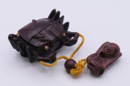 A hardwood crab inro with octopus netsuke. The former 7.5 cm wide.