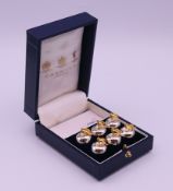 A cased set of six Garrard apple-form place name holders. 2.3 cm high.