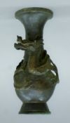 A small Japanese bronze vase decorated with a dragon. 15.5 cm high.