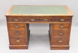 A Victorian walnut pedestal desk. 122 cm wide.