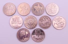 A collection of various coins, including a 1900 silver crown, a 1996 five pound coin,