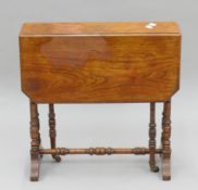 A Victorian walnut Sutherland table. 15.5 cm wide flaps down x 60.5 cm high.