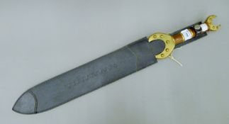 A Celtic reenactment sword in leather scabbard. 69 cm long.