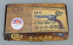 A boxed Colt 45 model airgun. The box 31 cm wide.