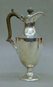 A silver hot water jug. 25 cm high. 418.2 grammes total weight.