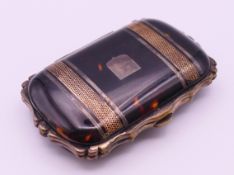 A Victorian tortoiseshell purse. 7.5 cm wide.