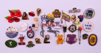 A collection of various pin badges. The bowls lady 3.5 cm high.