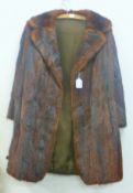 A ladies' fur jacket. Length 85 cm.