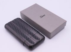 A boxed Zino carbon fibre cigar holder. 13.5 cm long.