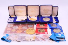 A collection of medallions and coins, including a 'Complete Decimal Issue and the Last £.s.d.