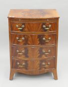A 20th century mahogany bow front chest of drawers with brushing slide. 62.5 cm wide.
