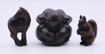 A squirrel netsuke, a figural carving and a horse netsuke. The former 4.5 cm high.