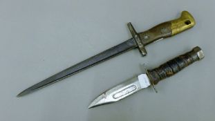 A French 'La Belle' knife converted to a bayonet and an American airman's knife.